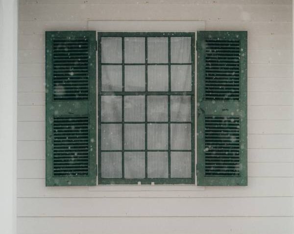 Installing exterior window trim over siding